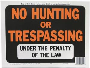 NO HUNTING or TRESPASSING UNDER THE PENALTY OF THE LAW